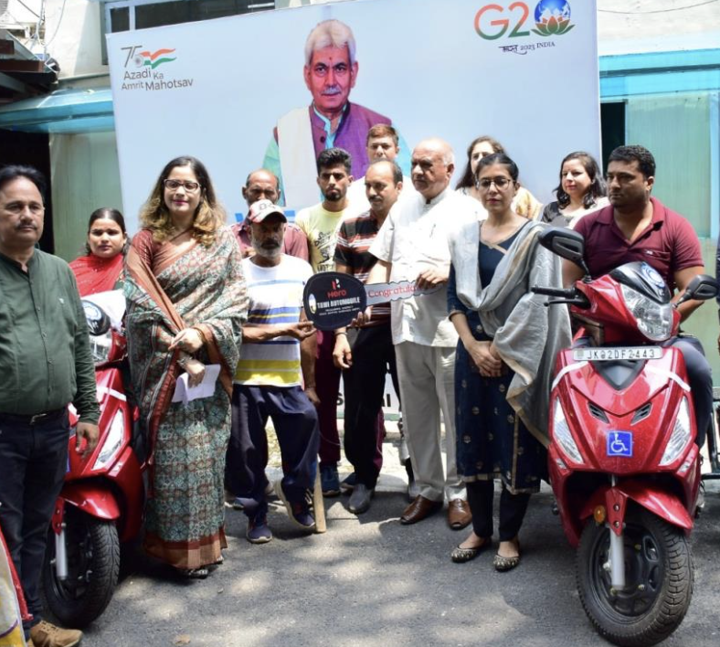 Retrofitted scooters distributed among specially-abled persons at DC office