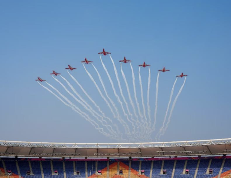 IAF’s Suryakiran Aerobatic team performs air show rehearsal over Narendra Modi Stadium