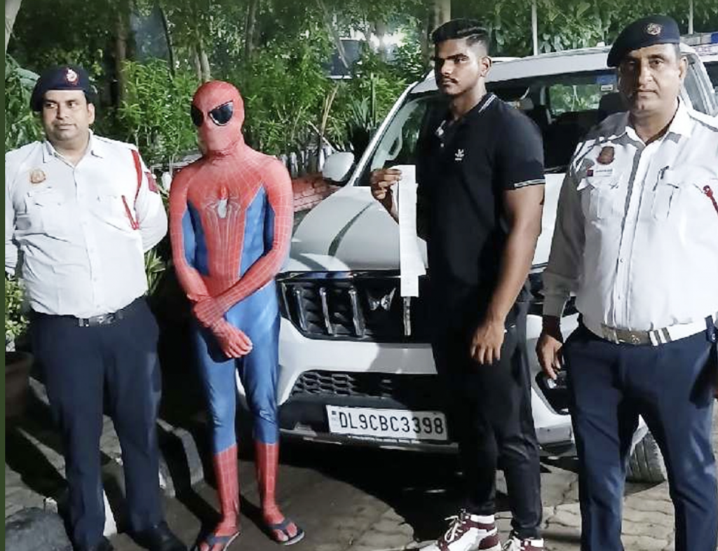 ‘Spiderman’ rides on car’s bonnet in Delhi, booked for traffic violations